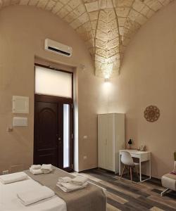 En eller flere senge i et værelse på Elysia Luxury Room