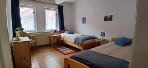 En eller flere senge i et værelse på Ferienhaus-Juliana