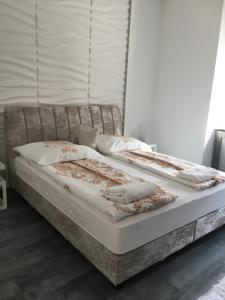 A bed or beds in a room at Synagogue Gozsdu Private Apartments