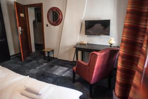 Posteľ alebo postele v izbe v ubytovaní Apartamenty Siedem Komnat Siedmiu Mistrzów