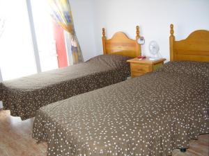 Łóżko lub łóżka w pokoju w obiekcie Los Miradores Del Puerto - 5207