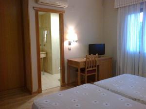 Postel nebo postele na pokoji v ubytování Hotel Anabel Baza