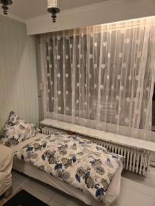 a bedroom with a bed and a window at Schönes Apartment mit Pool&Sauna in Bingen am Rhein +15 photos