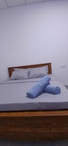 En eller flere senge i et værelse på Wanguwa Lodge & Restaurant