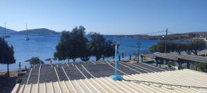 a view of a body of water with a dock at Filina's Studio Corner in Maltezana