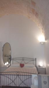 Ένα ή περισσότερα κρεβάτια σε δωμάτιο στο Dimora Polimnia