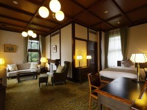 a hotel room with a bed and a living room at Nara Hotel in Nara +62 photos