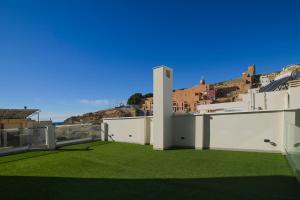 a view from the roof of a house with grass at Hostel Nixar in Almería