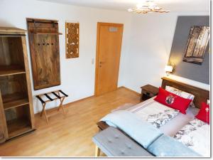 a living room with a bed and a couch at Fewo-Egger-Thalmann in Virgen