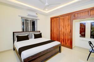 En eller flere senge i et værelse på Hotel O RS HOTELS