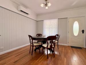 a dining room with a table and chairs at Casa Tranquilo in Kanighan +4 photos