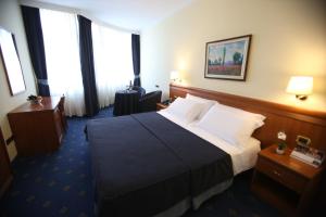 Postel nebo postele na pokoji v ubytování Hotel Continental