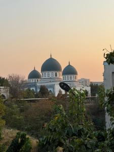 a building with three domes on top of it at Chorsu Old City in Tashkent