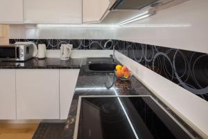 Kuchyň nebo kuchyňský kout v ubytování Apartment Mirjana