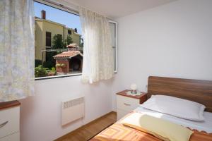 Postel nebo postele na pokoji v ubytování Apartment Mirjana