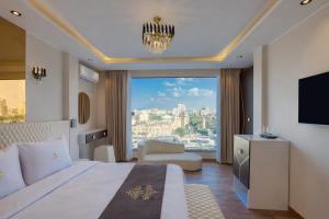 a hotel room with a bed and a large window at Casa Figueroa - Boutique Hotel- Adults Only in Cairo +61 photos
