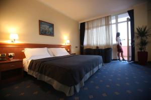Postel nebo postele na pokoji v ubytování Hotel Continental