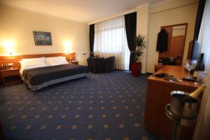 Postel nebo postele na pokoji v ubytování Hotel Continental