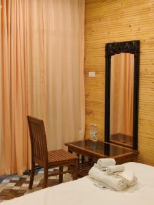 En eller flere senge i et værelse på The O2H Agonda Beach Resort