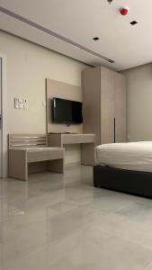 Et tv og/eller underholdning på فندق قمم الصفوه الفندقيه