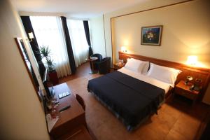 Postel nebo postele na pokoji v ubytování Hotel Continental