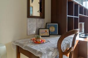 a table with a plate of food on top of it at Suite Carpiano in Melegnano