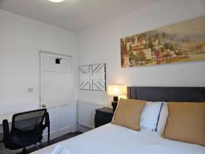 En eller flere senge i et værelse på Central Maison Indigo