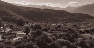 a black and white photo of a village in the mountains at Gurba's House in Aridaia