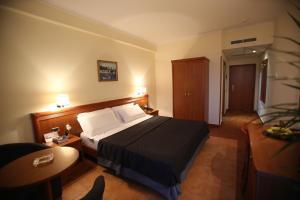 Postel nebo postele na pokoji v ubytování Hotel Continental