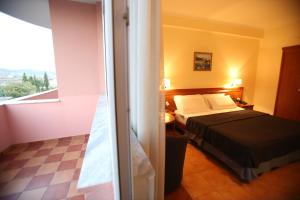 Postel nebo postele na pokoji v ubytování Hotel Continental