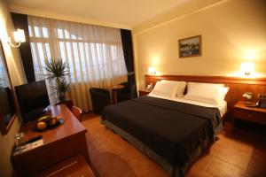 Postel nebo postele na pokoji v ubytování Hotel Continental