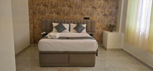 En eller flere senge i et værelse på Hotel Airport Transit