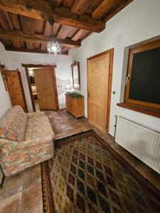 a living room with a couch and a tv at Bergbauer Offenburg in Pöls