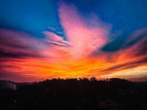 a sunset with colorful clouds in the sky at Villa Calton 32 Villa in Weligama Bay in Weligama