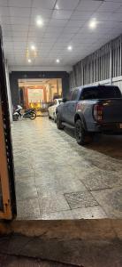 a parking garage with cars parked in it at Motel Anh Khoa in Tam Kỳ