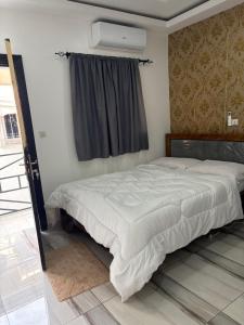 En eller flere senge i et værelse på Résidence KENZO