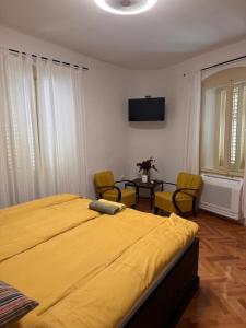 En eller flere senge i et værelse på Tri srca 2 - De Luxe 2