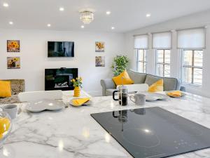 a living room with a table and a couch at The Haven Lodge in Clifton