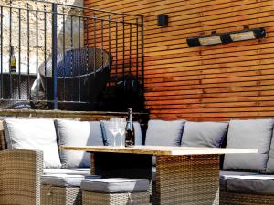 a table with a bottle of wine on a patio at Killerby Old Hall - Uk47711 in Cayton