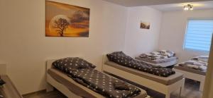 a room with two beds with pillows on them at Sson-Appartments in Detmold