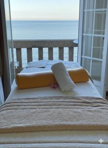 En eller flere senge i et værelse på Hotel Miramar Playa America Nigran