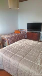 En eller flere senge i et værelse på La Casa del Sole