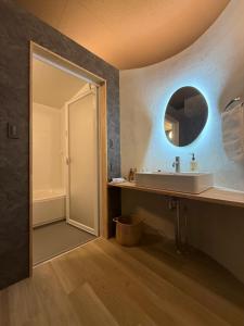 a bathroom with a sink and a mirror at 欒裏町ouchi uramachi in Matsumoto +22 photos