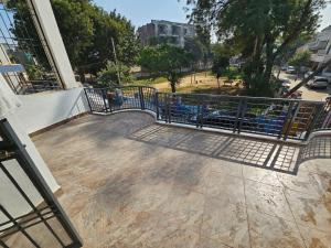 a balcony with a railing on a building at AnjuShyam HomeStay in Agra +4 photos