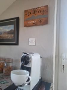 a kitchen counter with a coffee maker and a bowl at Samona in Kilkeel