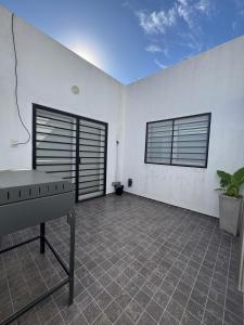 En balkon eller terrasse på Departamento Moderno y acogedor Villa María