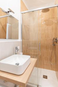 a bathroom with a sink and a shower at Il Giardinetto Guest House in Civitavecchia