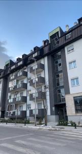 an apartment building on the side of a street at Apartman Luka in Cetinje