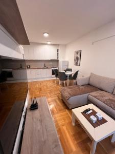 a living room with a couch and a table at Apartman Luka in Cetinje