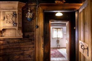 an open door to a room with wooden walls at Chalet Mühlburger in Gruben